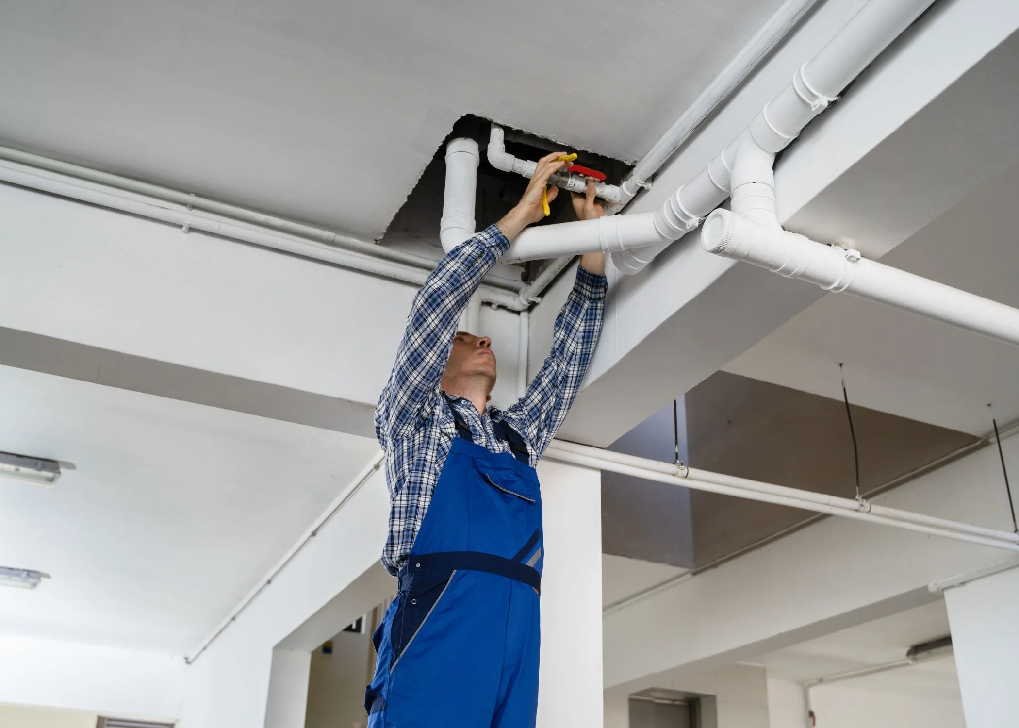 Jackson Mechanical technician fixing pipes